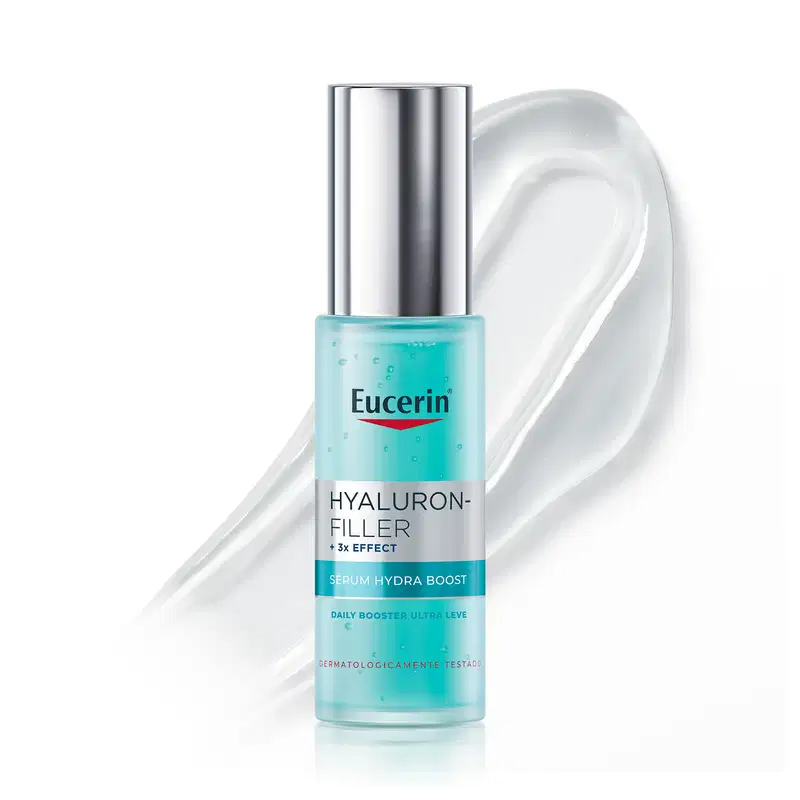 Frasco de item de perfumaria da marca Eucerin com textura líquida, transparente e brilhante, com bolhas e espuma, sobre superfície branca.