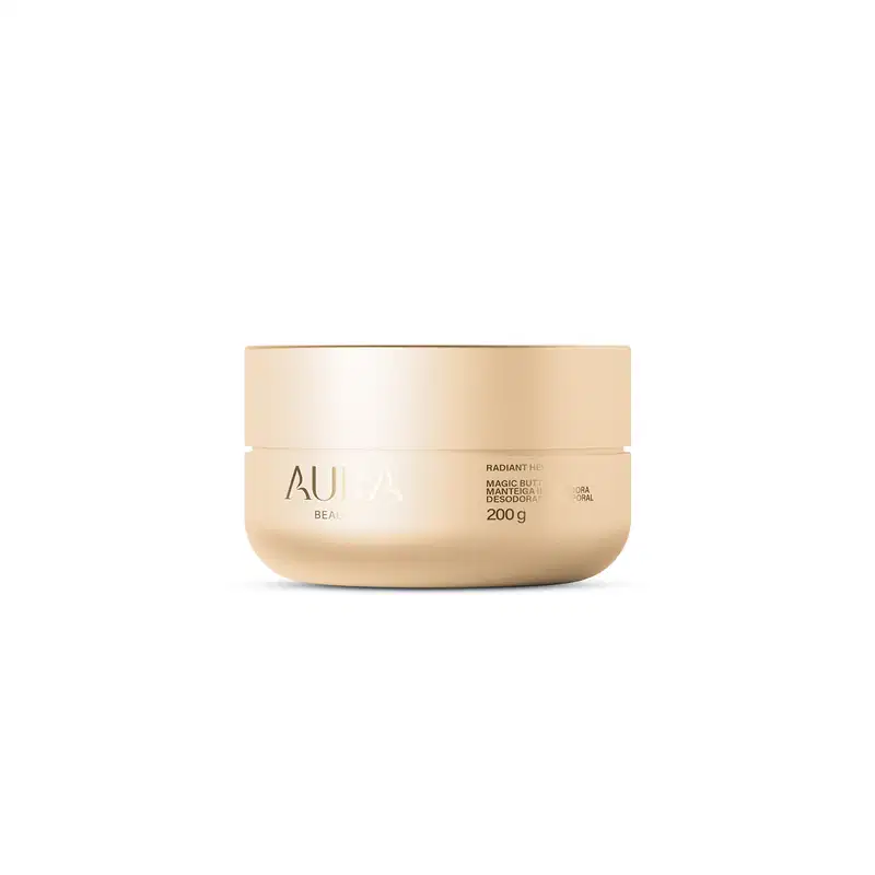 Pote de creme dourado da marca Aura Beauty, com rótulo destacando o nome do produto "Magic Butter" e informações sobre o conteúdo de 200g. Embalagem com design minimalista e elegante, em tons neutros.