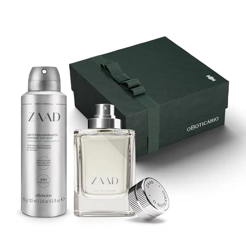 Caixa de presente preta com detalhes prateados e dois itens da marca Zaad em embalagens nas cores cinza e prata, sendo um eau de parfum de95ml e um desodorante aerossol de 75g/125ml.