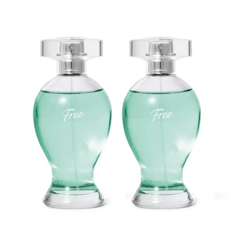 Dois frascos transparentes em formatos curvilíneos com líquidos azuis, pulverizadores prateados e tampas transparentes contendo desodorante colônia Boticollection Free.