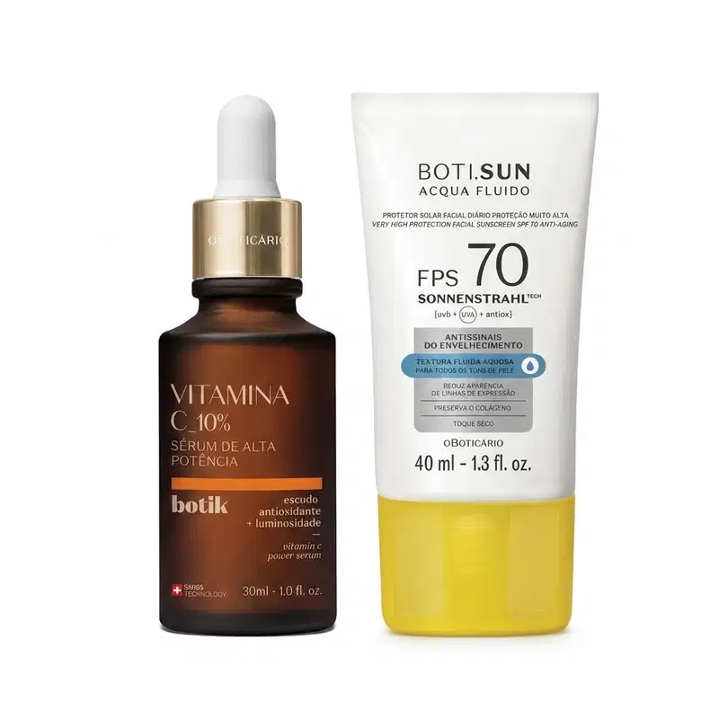 Dois itens de skincare, sendo um frasco de sérum facial de vitamina C 10% da linha Botik na cor marrom com tapa conta gotas dourada o e um tubo de protetor solar facial FPS 70 da linha Boti.SUN com frasco branco e tampa amarela.