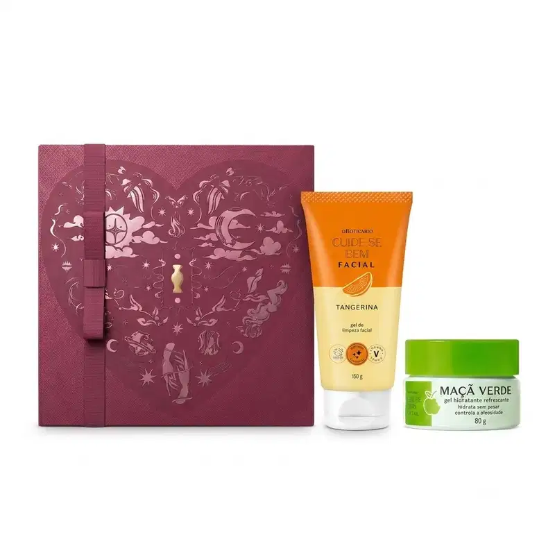 Caixa de presente de cor vinho com um grande coração contendo ilustrações em relevo de temática celestial. Ao lado, uma bisnaga laranja da linha Cuide-se bem Tangerina e um pote de hidratante branco com tampa verde com fragrância de Maçã Verde.