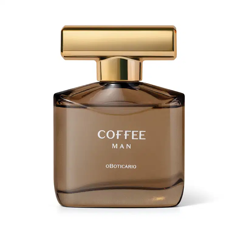 Imagem de um frasco de desodorante colônia da marca Coffee Man em embalagem de vidro marrom com tampa dourada, sobre superfície clara em ambiente minimalista. Possui um design moderno e sofisticado para momentos inesquecíveis.