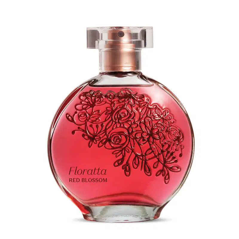 O frasco de vidro tem um formato arredondado e é feito de vidro transparente, com um bocal de metal rosado. O líquido dentro do frasco tem uma cor vermelha vibrante. Na parte frontal do frasco, há um desenho decorativo de rosas vermelhas estilizadas.