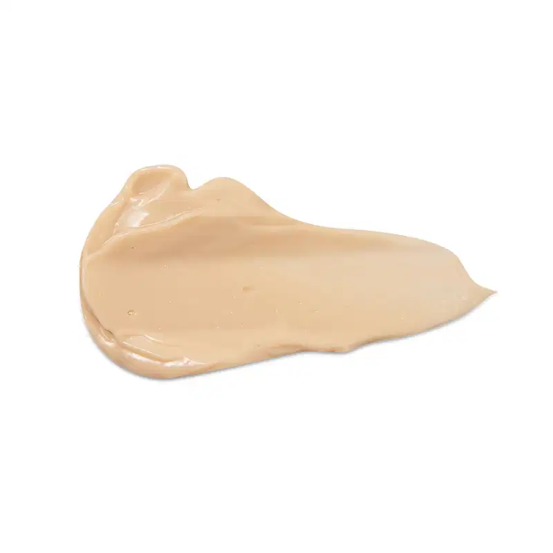 Textura cremosa e amarela da loção radiante corporal Nativa SPA Ameixa Dourada com aparência brilhante e lisa, espalhada em superfície branca.