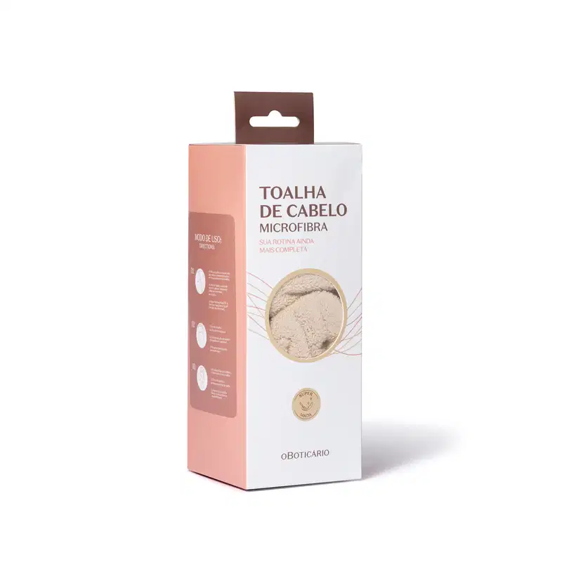 Toalha de cabelo microfibra da marca O Boticário, em embalagem retangular branca com detalhes em marrom, apresentando texto informativo sobre o produto.