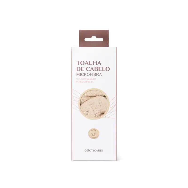Toalha de cabelo microfibra da marca O Boticário, em embalagem retangular branca com detalhes em marrom, apresentando texto informativo sobre o produto.