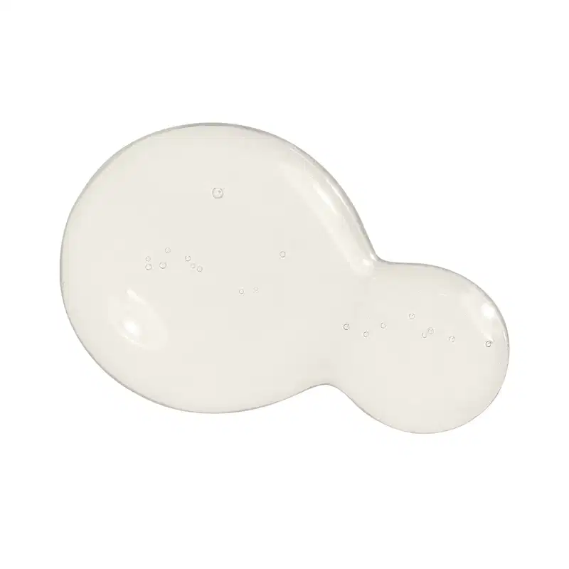 Textura do sérum antioleosidade Malbec Facial com aspecto gelatinoso, brilhante e transparente, com pequenas bolhas dispersas sobre uma superfície lisa e uniforme.
