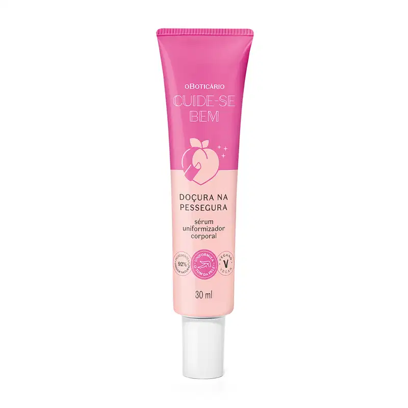 O produto apresentado é um sérum uniformizador corporal. A embalagem é um tubo de cor rosa com o nome da linha e do produto impresso. O produto é descrito como um sérum para a pele, com a promessa de uniformizar a aparência corporal.