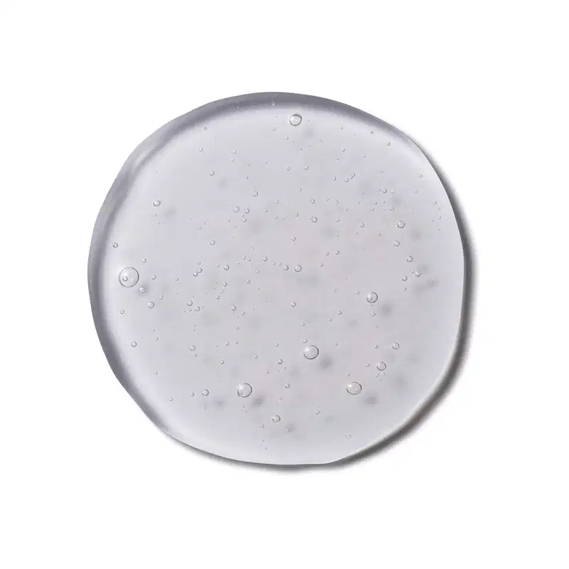 Imagem da textura transparente e brilhante do Shampoo Cuide-se Bem Feira Vinagre de Maçã, com pequenas bolhas de ar dispersas pela superfície.