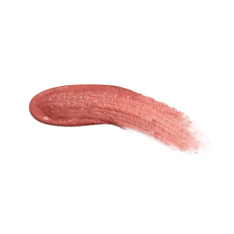 Textura cremosa e brilhante de batom líquido rosa French Rose da marca Make B. One Velvet Sublime, com superfície irregular e aspecto úmido, ocupando a maior parte da imagem em fundo branco.