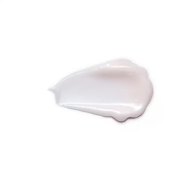 Textura cremosa e brilhante de creme de limpeza facial Botik  Resveratrol e Silício em fundo branco, com superfície lisa e aparência translúcida.