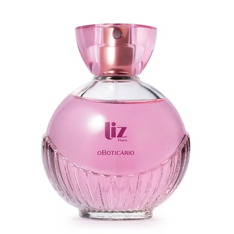 Vidro arredondado com líquido rosa, letras vinho, borrifador dourado e tampa transparente contendo 100ml de desodorante colônia Liz Flora.