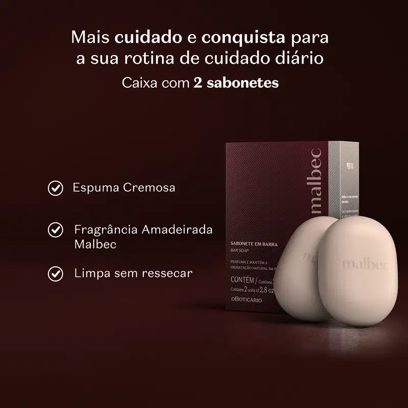 Caixa de sabonete em barra com 2 unidades da marca Malbec em ambiente marrom com texto em branco que diz que o produto oferece mais cuidado e conquista para a sua rotina, com a fragrância amadeirada de Malbec e espuma cremosa, que limpa sem ressecar.