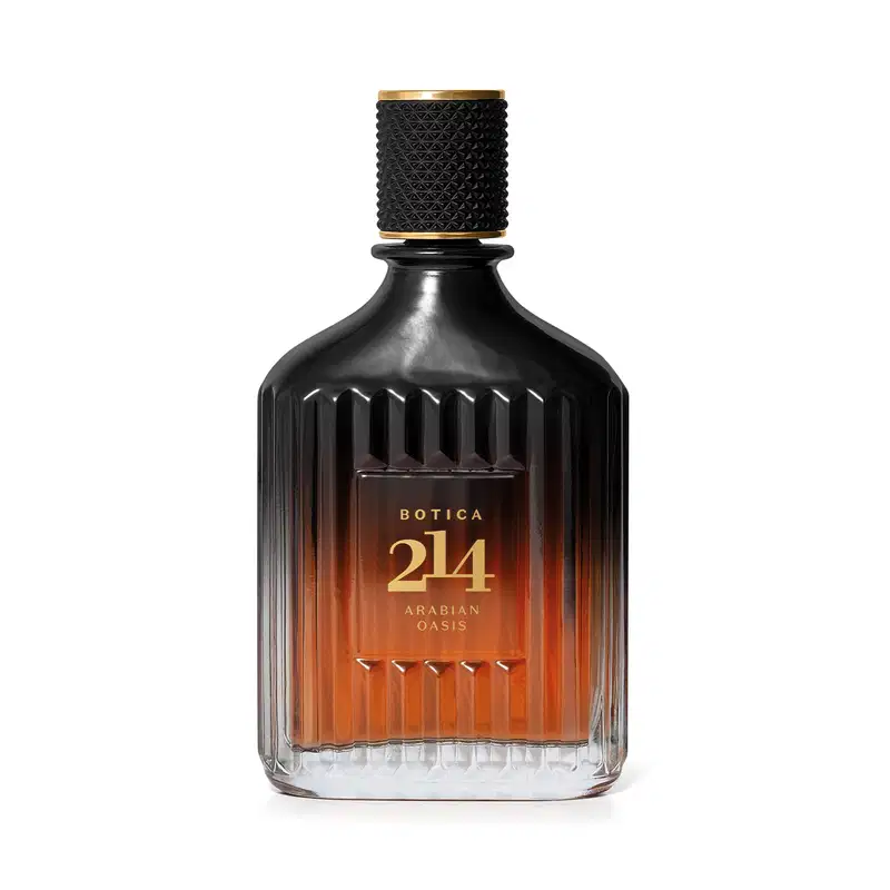 Frasco de perfume Botica 214 Arabian Oasis, com design de vidro facetado em tons de laranja e preto, com tampa dourada e rótulo destacando o nome da fragrância.
