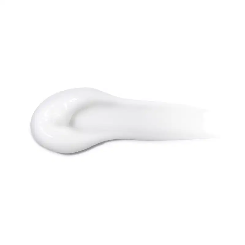 Textura branca, cremosa e brilhante de um item para corpo e balho, com superfície lisa e uniforme, ocupando a maior parte da imagem.