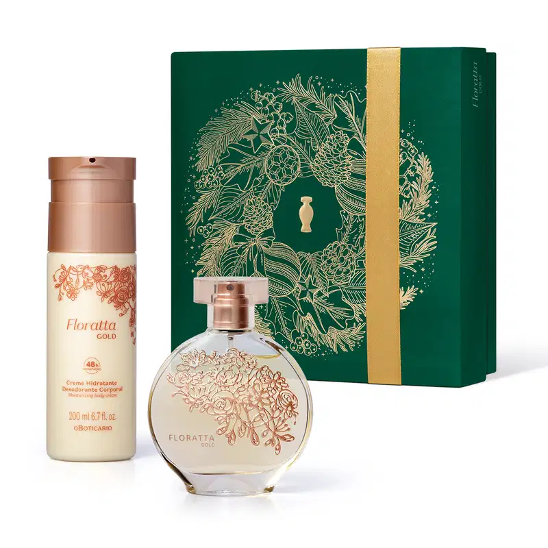 Frasco de vidro de desodorante colônia Floratta Gold arredondado e transparente, com flores douradas gravadas em relevo Ao lado um frasco branco com tampa dourada de body splash da mesma linha e uma caixa preenteável verde com ilustração natalina.