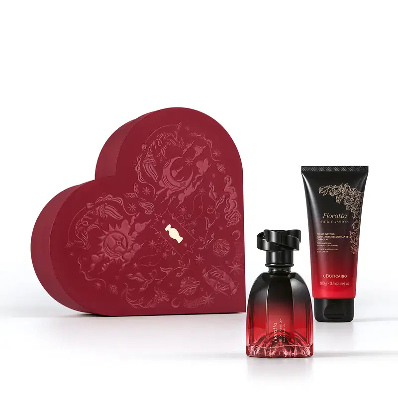 Caixa vermelha em formato de coração com relevo dourado de temática celestial. A frente, um frasco de item de perfumaria  Floratta Red Passion e bisnaga de creme corporal da mesma marca, ambos com embalagem degradê de vermelho para preto e tampa preta.