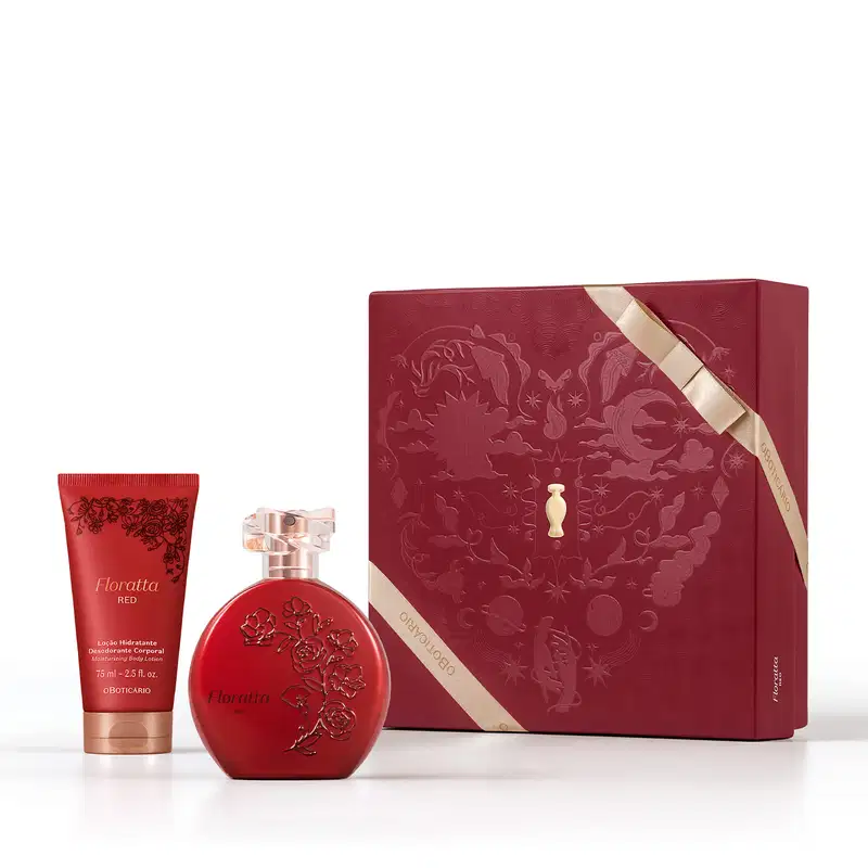 Caixa de presente de cor vinho com um grande coração ilustrado detalhes de temática celestial. Ao lado, um frasco vermelho opaco com relevo floral e tampa transparente de desodorante colônia Floratta Red e bisnaga de loção corporal vermelha da mesma linha