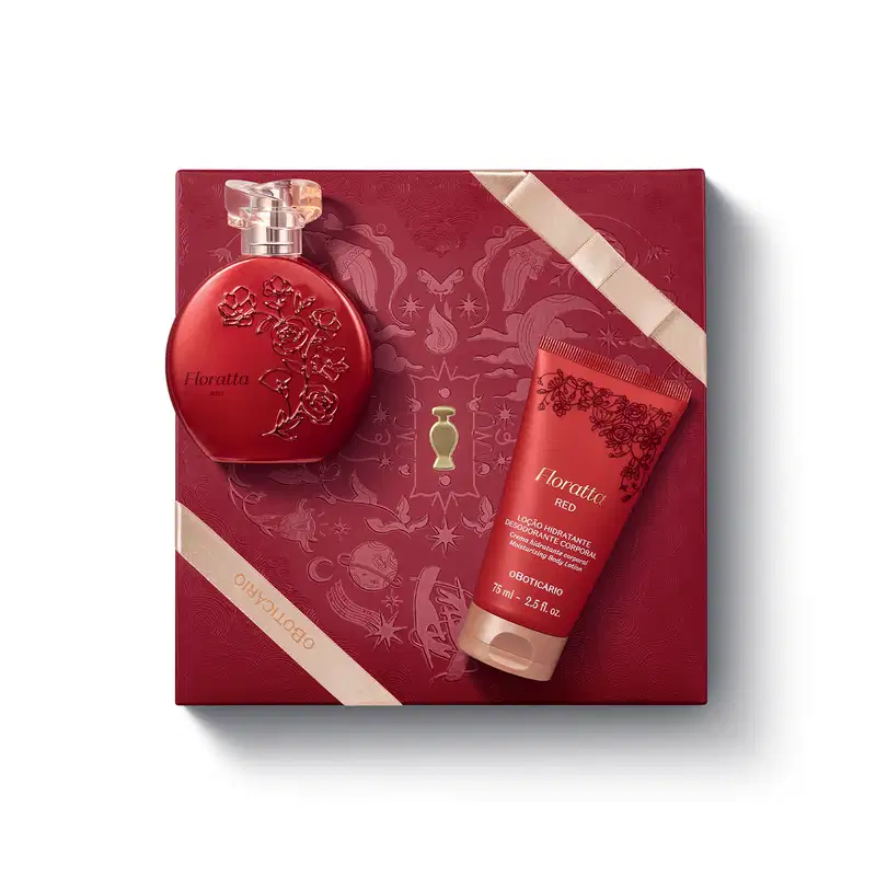 Caixa de presente de cor vinho com um grande coração ilustrado detalhes de temática celestial. Sobre ela, frasco vermelho opaco com relevo floral e tampa transparente de desodorante colônia Floratta Red e bisnaga de loção corporal vermelha da mesma linha.