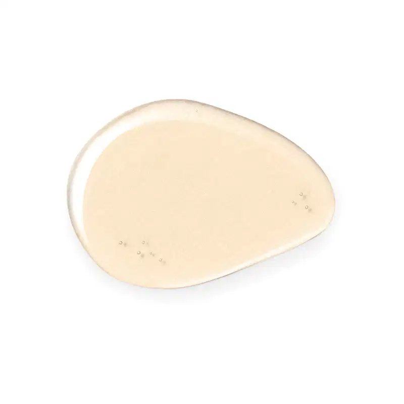 Textura líquida e transparente de item de cuidados de corpo e banho em tom rosa claro, com pequenas bolhas visíveis na superfície.