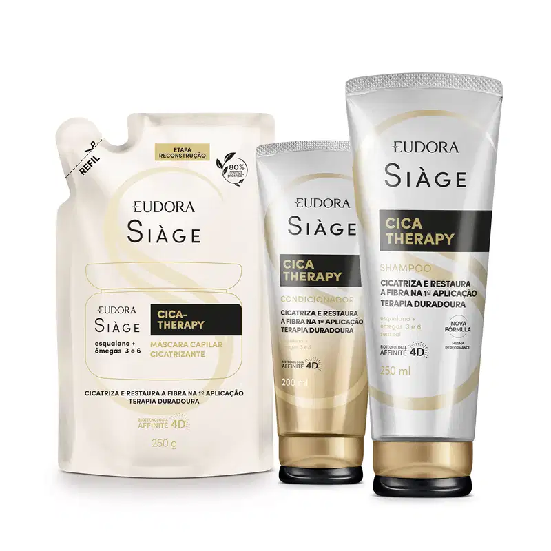 A imagem mostra um kit com três produtos, um refil de máscara capilar, uma bisnaga de condicionador e outra de shampoo. Todos com embalagem branca e bege, letras pretas e douradas.