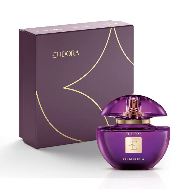 Frasco de perfume Eudora em embalagem roxa e dourada, com design elegante e sofisticado. O produto é apresentado em uma caixa de papelão também na cor roxa, com detalhes dourados.