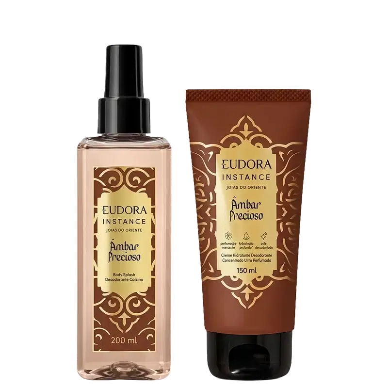 Eudora Instance Âmbar Precioso: Body Splash 200ml com frasco spray transparente e Creme Hidratante 150ml em tubo marrom. Embalagens com detalhes dourados e padrão ornamental. Produtos da linha Joias do Oriente.