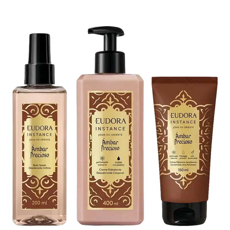 Três produtos Eudora Instance Âmbar Precioso: Body Splash 200ml com spray, Creme Hidratante Desodorante Corporal 400ml com bomba, e Creme Desodorante 150ml em tubo. Embalagens marrom e bege com detalhes dourados ornamentais.