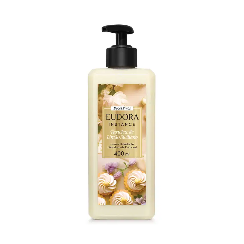 Frasco plástico transparente 400ml com bomba dosadora preta, produto em cor verde-limão claríssimo. Rótulo com fundo bege claro, apresentando imagens de flores e doces de limão. Retângulo dourado ao centro com o nome do produto em preto e branco.