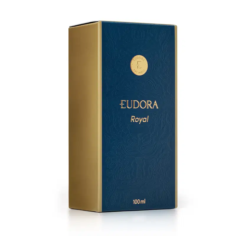 Caixa de Eudora Royal em azul escuro com detalhes dourados, contendo 100 ml do produto. A embalagem apresenta um padrão decorativo em relevo e o logotipo da marca Eudora.
