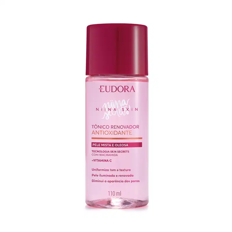 Frasco plástico transparente contendo líquido rosado. Tampa protetora na cor vinho. Embalagem com cores rosa e vinho, típicas da linha. Rótulo transparente com texto em rosa pink, quase vermelhor, e alaranjado. Nome da marca Niina Secrets em branco.