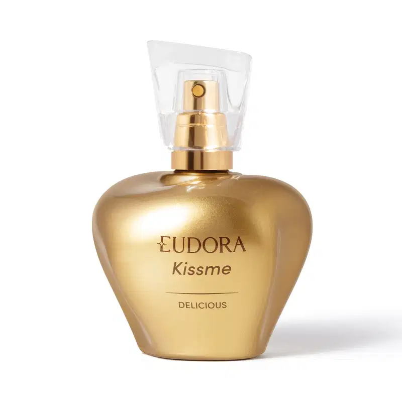 Frasco dourado de perfume Eudora Kissme, com rótulo em dourado e branco, contendo texto "Delicious". O frasco possui um design elegante e moderno, com um bico pulverizador na parte superior.