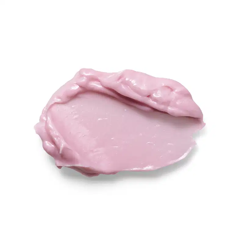A imagem mostra uma porção do hidratante Eudora rosé. Sua textura é espessa e cremosa de cor rosa claro. A aparência viscosa e brilhante sugere que é um produto rico em nutrientes.