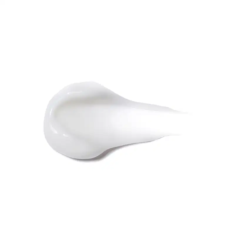 Textura do produto Creme para Pentear - Definição. Possui uma forma arredondada e suave, com uma superfície lisa e brilhante, em uma tonalidade branca. Não há rótulos ou textos visíveis na imagem, apenas a forma do produto em si.