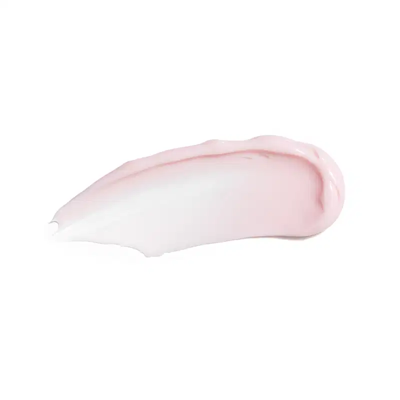 Textura do creme ou loção cosmética de cor rosa e branca. Possui uma forma arredondada e suave, com uma textura cremosa e brilhante. Não é possível identificar qualquer texto ou rótulo visível na imagem.