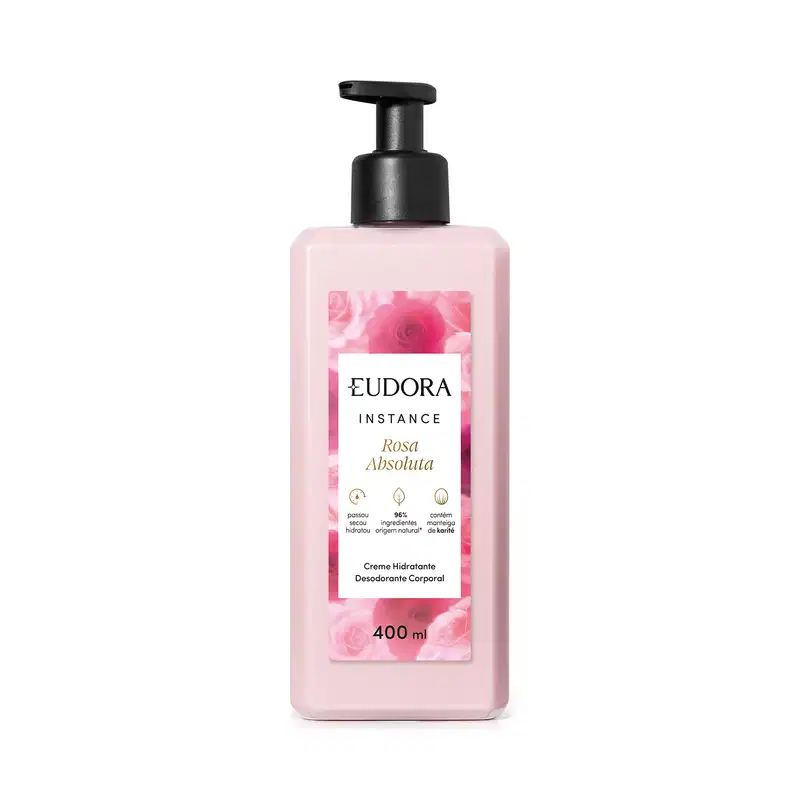 Creme hidratante desodorante corporal da linha Instance de Eudora. A embalagem é um frasco plástico rosa claro com um rótulo branco destacando o nome "Rosa Absoluta" e informações sobre o produto. O frasco possui um dispensador preto na parte superior.
