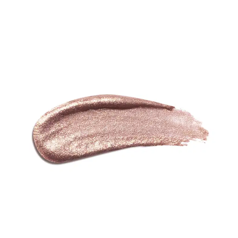 Textura do produto Iluminador Líquido da linha Niina Secrets. Com tonalidade rosé, com partículas de brilho.