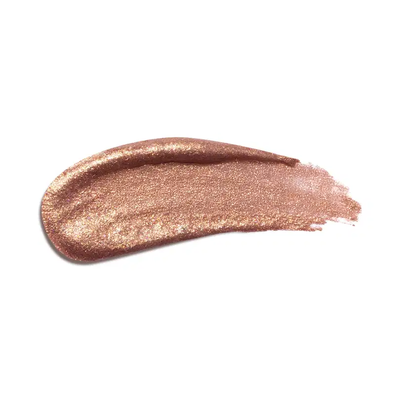 Textura do produto Iluminador Líquido da linha Niina Secrets. Com tonalidade bronze, com partículas de brilho.