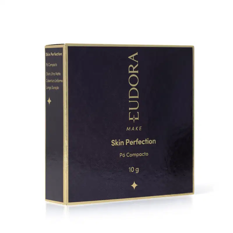Caixa preta e dourada de pó compacto da marca Eudora Make, com texto "Skin Perfection" e informações sobre o produto.

