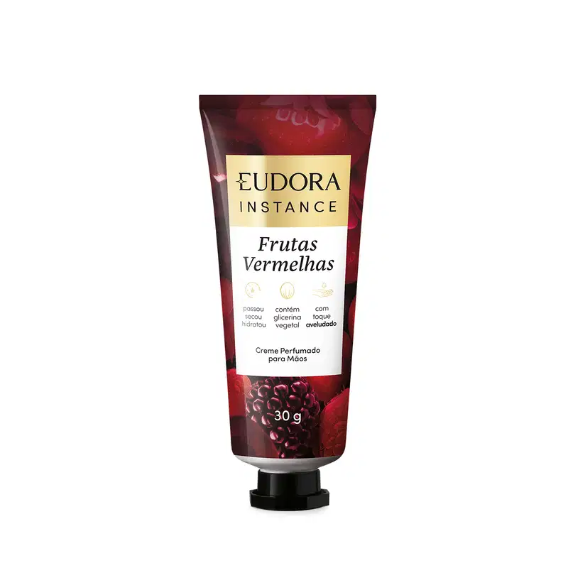 Creme perfumado para mãos da linha Instance da Eudora, com embalagem de 30g em tubo plástico vermelho escuro, destacando o nome da marca e o produto "Frutas Vermelhas" em letras brancas e douradas.
