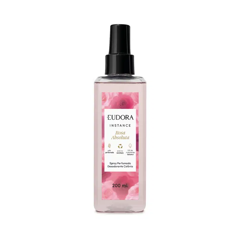 O produto apresentado é um spray perfumado desodorante da linha Instance Rosa Absoluta. O frasco é de plástico transparente com um rótulo rosa, destacando informações sobre o produto. Possui um design elegante e minimalista, com uma tampa preta.