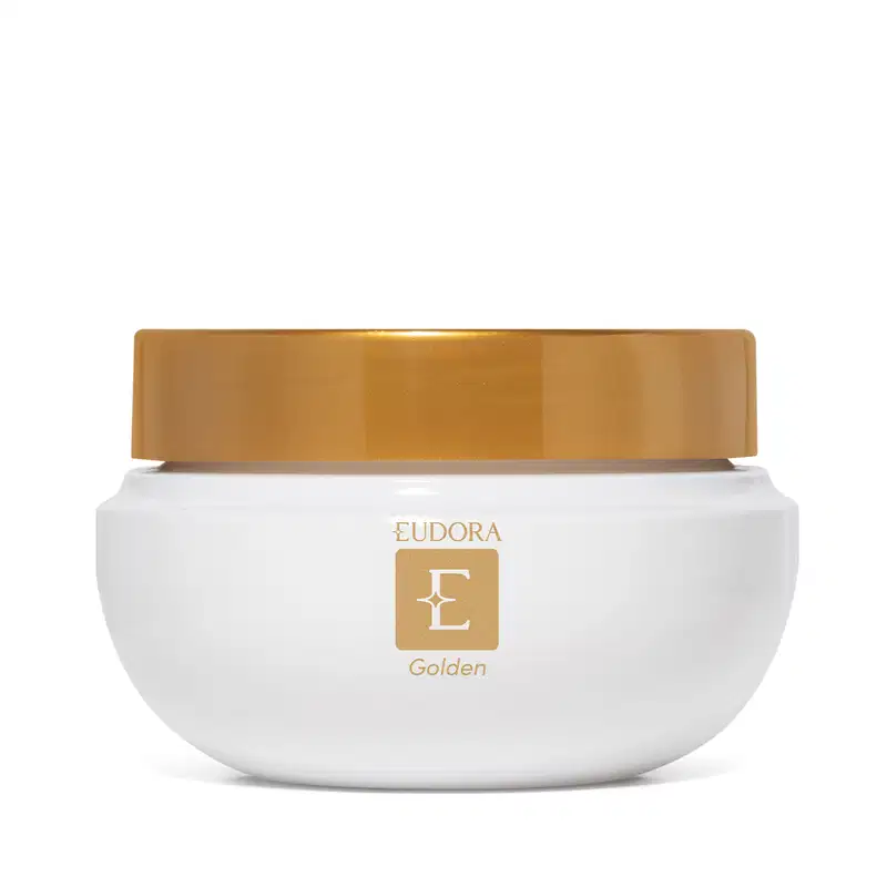 Frasco de creme hidratante branco com tampa dourada, exibindo o logotipo da marca Eudora Golden. O produto apresenta uma embalagem simples e elegante, com destaque para a cor dourada da tampa.