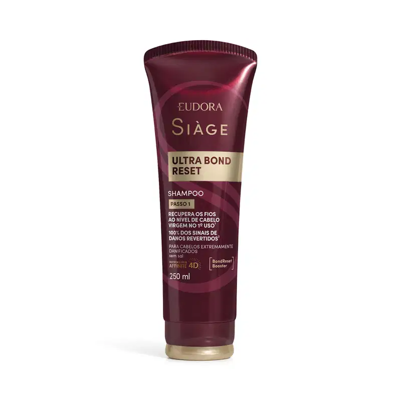 Frasco de shampoo da marca Siàge, na cor vinho, com rótulo em dourado contendo o texto "Ultra Bond Reset" e informações sobre recuperação dos fios.