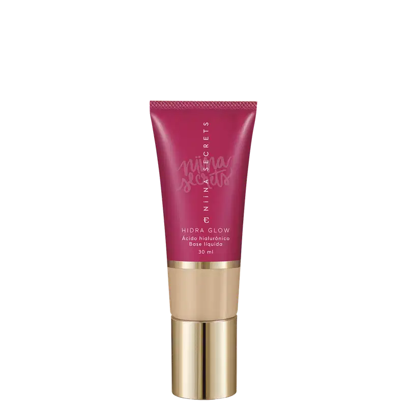 Tubo de base líquida Hidra Glow da marca Niina Secrets, com embalagem rosa e detalhes dourados, contendo 30 ml do produto.