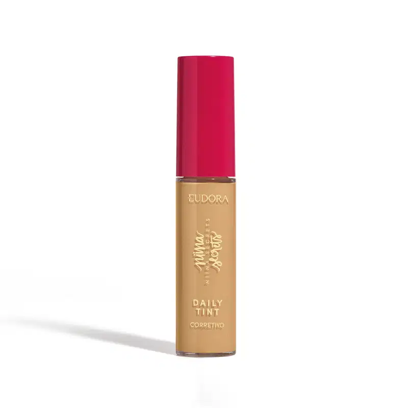 Corretivo líquido Eudora Daily Tint com frasco cilíndrico de vidro, bege e tampa rosada, rótulo com texto em dourado.
