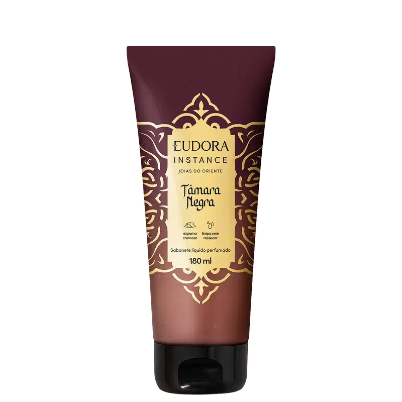 Sabonete líquido perfumado Eudora Instance Tâmara Negra em embalagem tube de 180ml. Frasco com predominância de cores marrom e dourado, decorado com padrões ornamentais. Rótulo destaca "espuma cremosa" e "limpa sem ressecar".