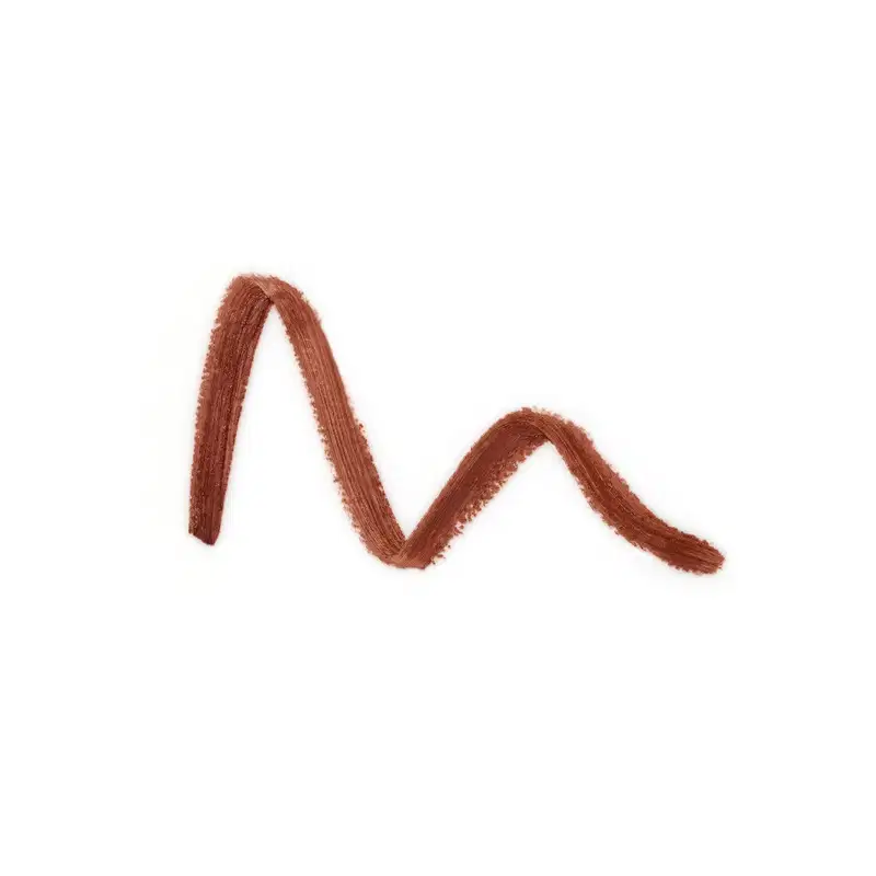 Textura na cor canela, com aparência levemente cremosa e brilhante, em superfície lisa e uniforme, sugerindo um produto de maquiagem.