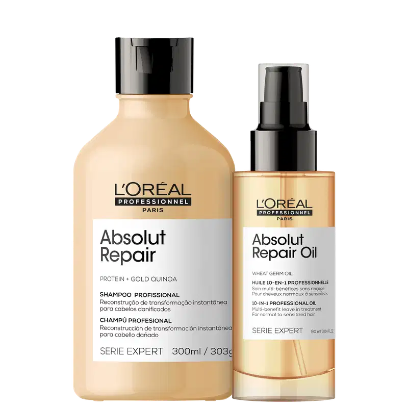 Um frasco de shampoo Absolut Repair e um frasco de óleo Absolut Repair Oil. O shampoo tem embalagem plástica transparente com rótulo preto e branco. O óleo tem embalagem plástica transparente com rótulo dourado e preto.