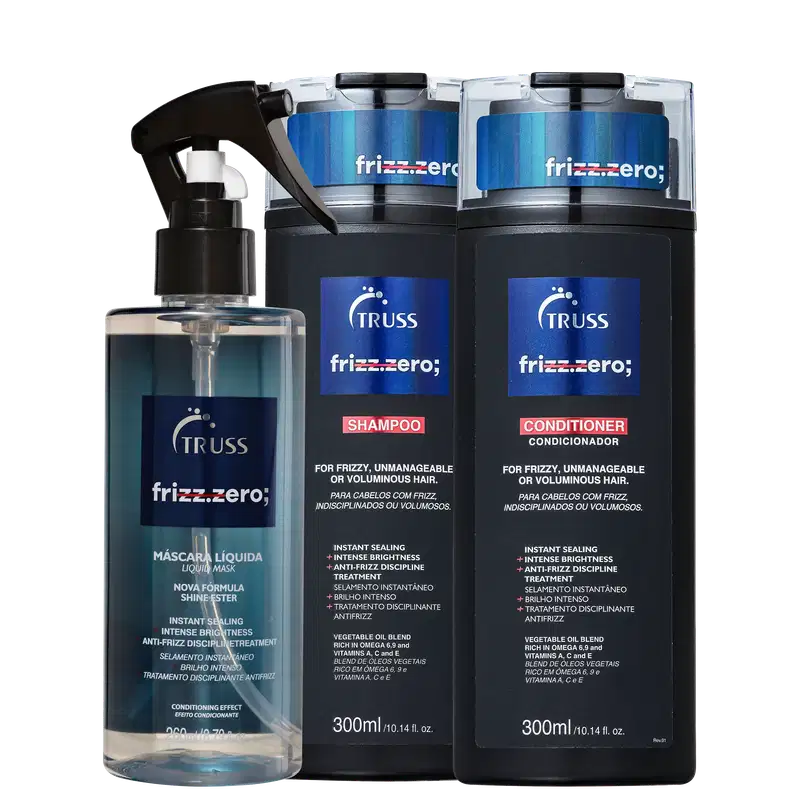 A imagem mostra uma linha de produtos de cabelo da marca Truss chamada "Frizz Zero". Há um frasco spray de máscara líquida, um pote de shampoo e um de condicionador. Todos os produtos têm uma aparência sofisticada em tons de azul e preto.